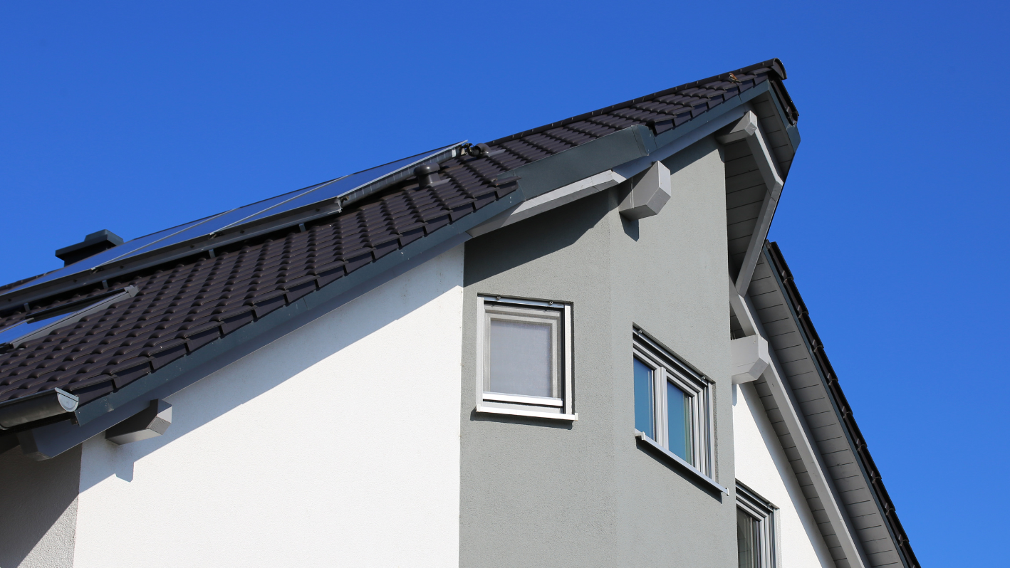 A house with a solar panel on the roof