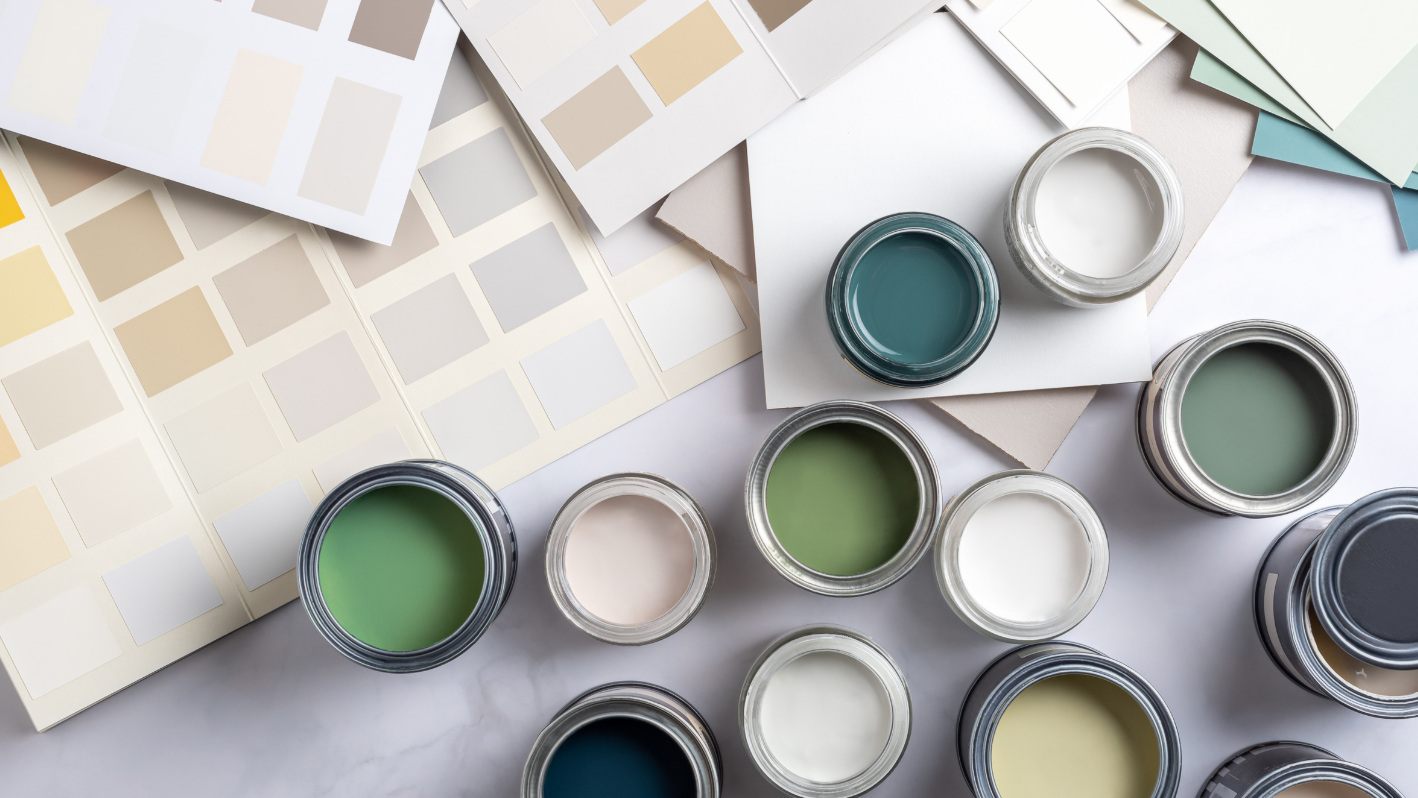 A group of paint cans sitting on top of a table