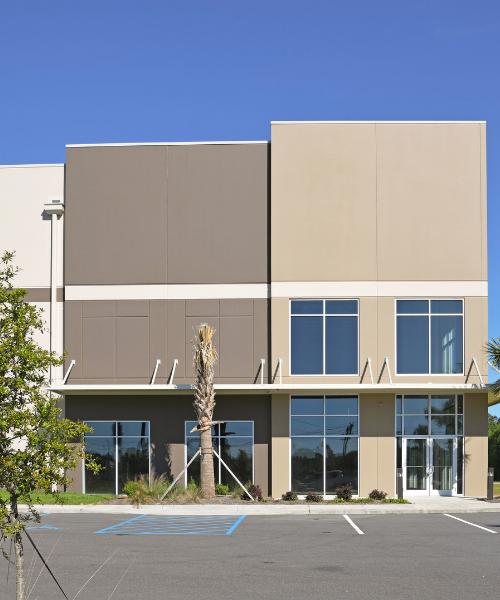 A building with a parking lot in front of it